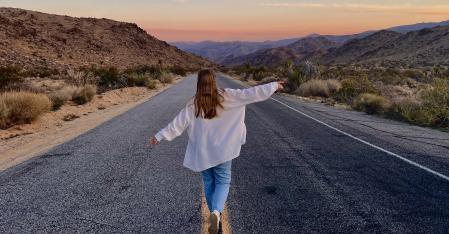 he Placement Process au pair walking down a dessert highway